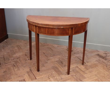 A George III inlaid mahogany card table