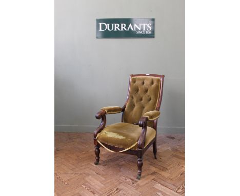 A Victorian upholstered rosewood button back armchair