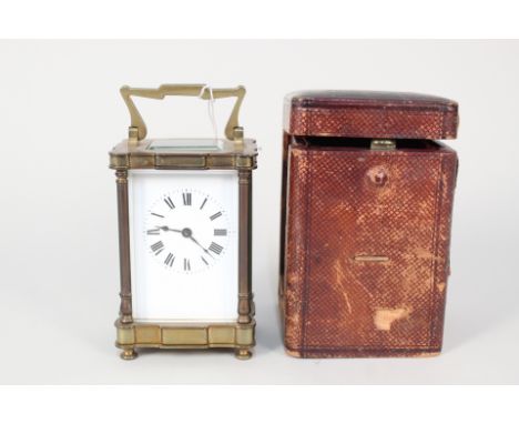 A cased brass carriage clock