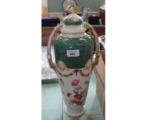 A German porcelain floral lidded vase with scale green decoration, height 17"