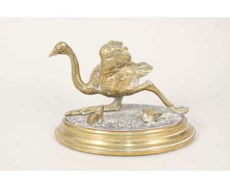 A brass inkwell in the form of an emu