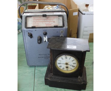 A black slate mantel clock plus a box of books etc