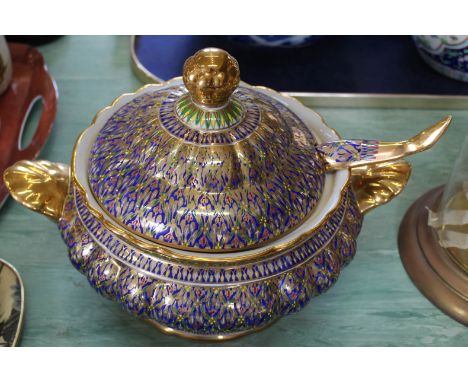 A continental blue and gilt porcelain tureen and ladle