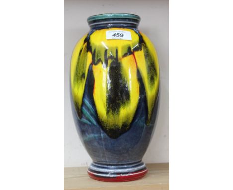 A Poole blue ground fruit decorated vase, height 10"