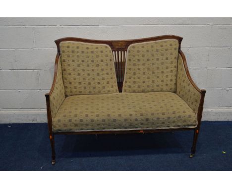 AN EDWARDIAN MAHOGANY TWO SEATER SOFA with string inlay with a foliate central inlay and more recent fabric upholstery all st