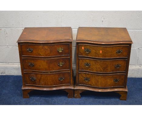A PAIR OF REPRODUCTION BURR WALNUT SERPENTINE THREE DRAWER BEDSIDE CABINETS on bracket feet, width 53cm x depth 41cm x height