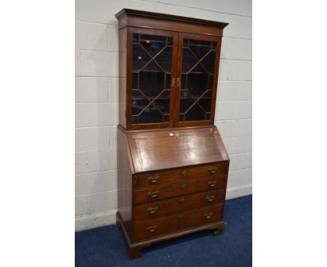 A GEORGE III ROSEWOOD, CROSSBANDED AND STRUNG BUREAU BOOKCASE, the top with double astragal glazed doors, the fall front door