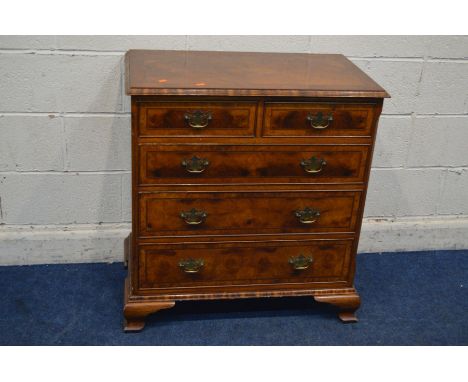 A REPRODUCTION WALNUT AND BURR WALNUT CHEST OF TWO SHORT OVER THREE LONG DRAWER, with brass swan neck handles, on ogee bracke