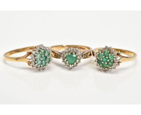 THREE  9CT GOLD EMERALD AND DIAMOND CLUSTER RINGS, to include two circular clusters set with circular cut emeralds and single