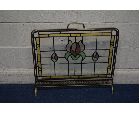 AN EARLY TO MID 20TH CENTURY BRASS AND LEAD GLAZED FIRESCREEN, width 70cm x height 67cm
