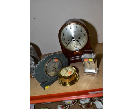 A BOWDEN &amp; SONS DOME TOPPED MAHOGANY CASED MANTEL CLOCK, standing on brass bun feet, having silvered dial with Arabic num