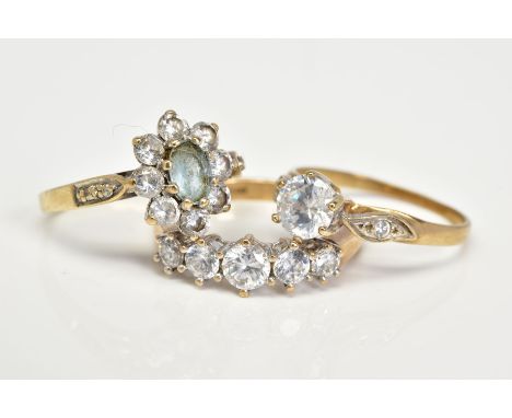 THREE 9CT GOLD GEM SET RINGS, the first designed as a cluster set with a central oval cut aquamarine within a cubic zirconia 