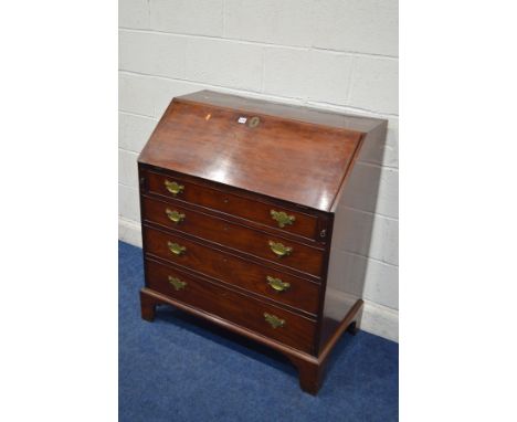 A GEORGIAN MAHOGANY BUREAU, the fall front revealing a fitted interior, above four exterior drawers, on bracket feet, width 9