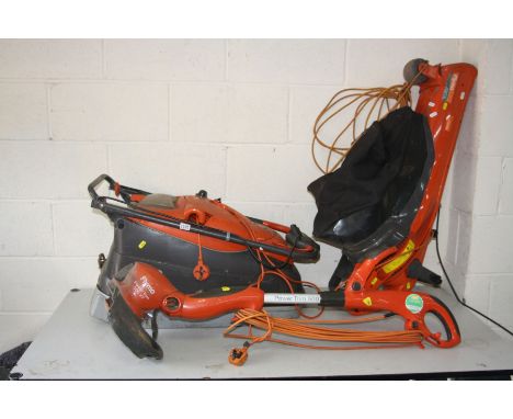 A FLYMO VISION COMPACT 330 LAWN MOWER, a Flymo Powertrim 500XT strimmer and a Flymo Gardenvac 2700w turbo (all PAT pass and w