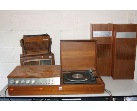 A VINTAGE FERGUSON MODEL 3400 RADIO GRAM, standing on a teak stand, fitted with a Garrard SP12 Mk2 turntable, a pair of model