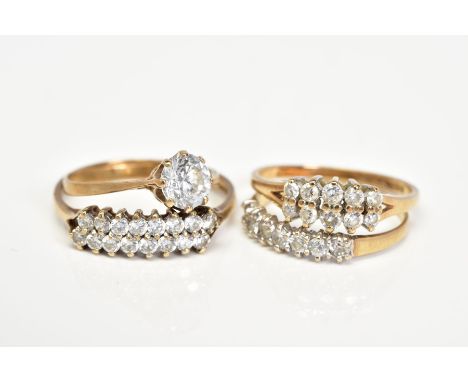 FOUR 9CT GOLD CUBIC ZIRCONIA SET RINGS, the first set with an asymmetrical double row of circular cut CZ, with a 9ct hallmark