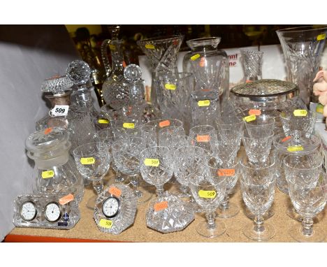 A QUANTITY OF CUT GLASS, including Edinburgh Crystal desk clock/barometer, a decanter with silver collar and decanter label, 