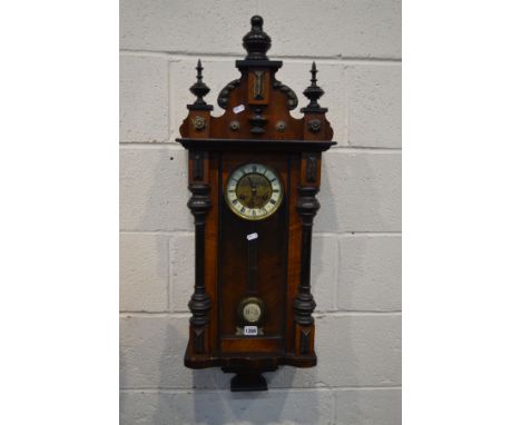 A LATE 19TH CENTURY WALNUT AND EBONISED SMALL VIENNA WALL CLOCK, height 97cm (winding key and pendulum) (losses)