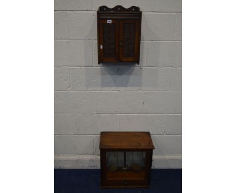 AN EARLY 20TH CENTURY OAK HANGING TWO DOOR SMOKERS CABINET, with two internal drawers, width 33cm x depth 17cm x height 45cm 