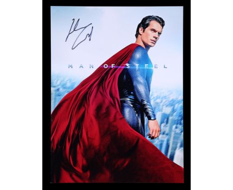 A "Superman: Man of Steel" (2013) publicity photgraph signed by Henry Cavill. A high quality print featuring Cavill in full S