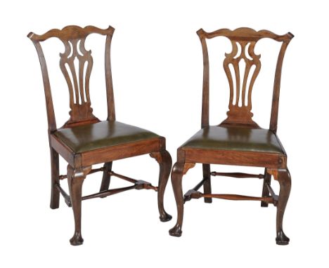  A pair of George II walnut side chairs  , circa 1750, in the manner of Thomas Chippendale, each with drop in seat 