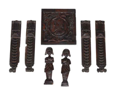 A set of four carved oak pilasters, 17th century, each Doric capital above a stylised tablet section and repeated lappet deco