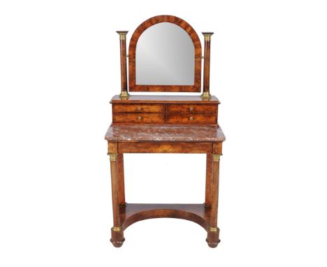  A Regency mahogany and gilt metal mounted dressing table,   circa 1820, the arched mirror above an arrangement of four drawe