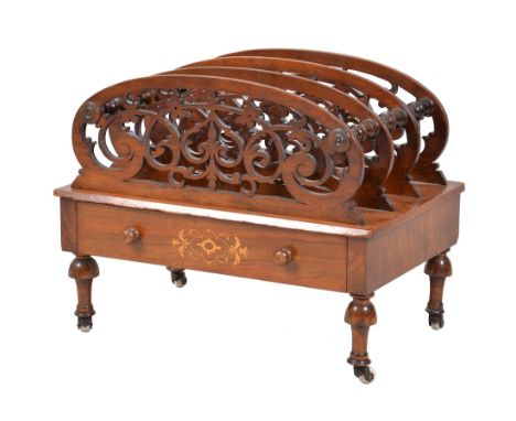  A mid Victorian walnut Canterbury  , circa 1870, the openwork scrolled dividers above a single marquetry inlaid frieze drawe