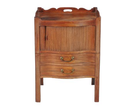  A George III mahogany night commode  , circa 1780, of serpentine outline, the tambour front enclosing compartment above the 