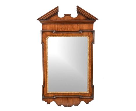  A walnut and parcel gilt wall mirror after the manner of William Kent  , late 19th century, with architectural pediment, 120