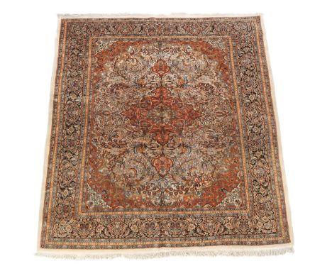  A Tabriz carpet  , part silk, approximately 317 x 213cm 