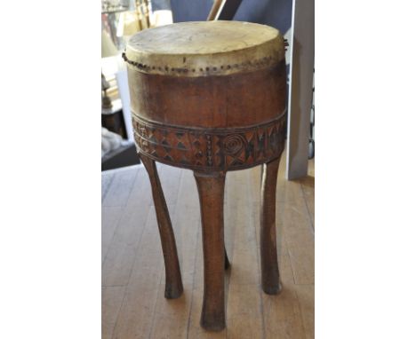 African drum with carved and painted decoration, height 67 cm width 32 cm