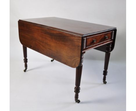 A Gillows style Pembroke table, mahogany, turned and reeded legs on castors, with drawer to one side, height 72 cm, width 103