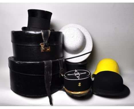 2 hat boxes and a collection of hats