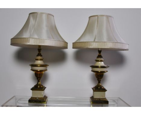 Lamps, A good quality pair of brass and cream enamel lamps in classical campana shape, with shades, height without shade 57 c