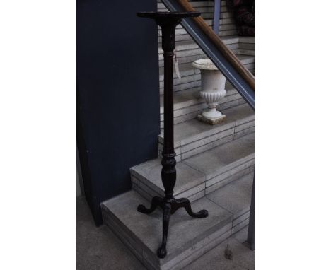 Mahogany torchere with tripod carved legs