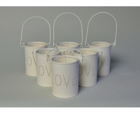 Set of 6 white t light holders with pierced 'love' and glass liner