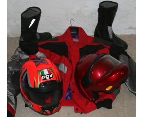 An RSR all-weather motorcycle jacket, a pair of all-weather boots, size 42, an AGV helmet, size M/L and a BMW helmet, (4).  P