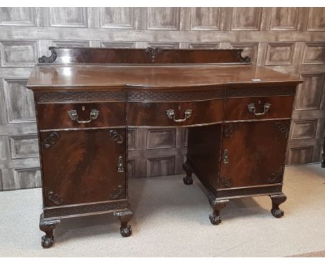 EDWARDIAN MAHOGANY PEDESTAL DESK/ DRESSING TABLEof Chippendale design, the raised back with beaded moulding, blind fretted fr