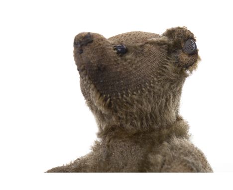 EARLY TWENTIETH CENTURY MINIATURE STEIFF TEDDY BEARthe gold plush teddy with maker's button to ear, not-jointed, two button e