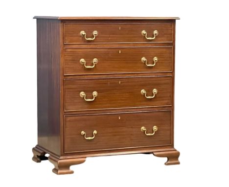 A vintage Georgian style mahogany chest of drawers with brass drop handles on bracket feet. 82x48x94cm 
