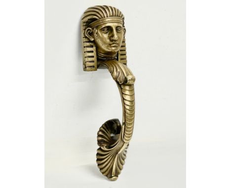A Victorian brass Egyptian Revival door knocker. 25cm 