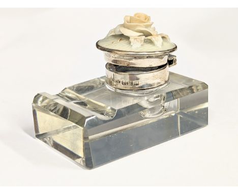 A silver and cut glass inkwell with porcelain rose decoration. 