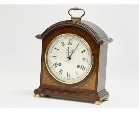 A Comitti of London inlaid mahogany mantle clock. With key. 18x8.5x24cm 