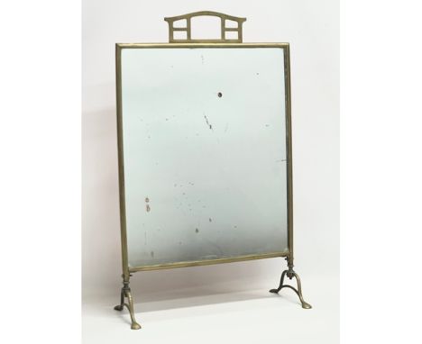 An Edwardian brass mirrored firescreen. 40x17x63.4cm 