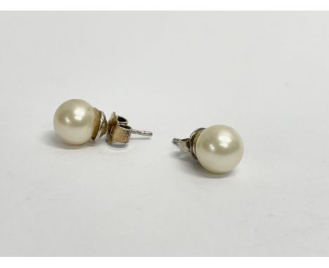 A pair of ladies 9ct gold and pearl earrings. 