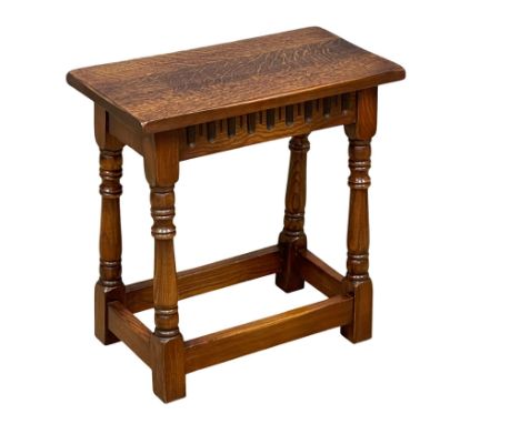 A vintage 17th century style oak stool. 48.5x25.5x49.5cm 
