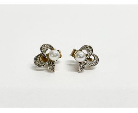A pair of ladies 9ct gold and pearl earrings. 