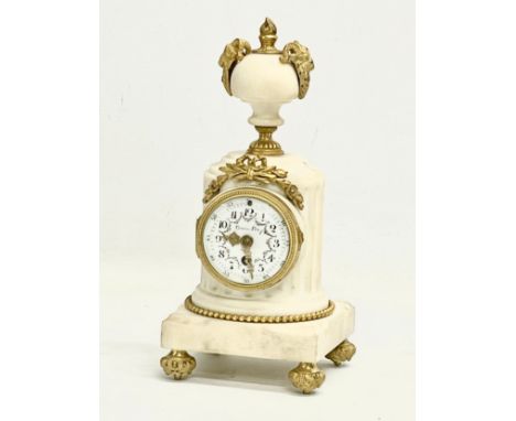 A late 19th century French marble mantle clock with brass mounts and enamel face. 11x11x23.5cm 