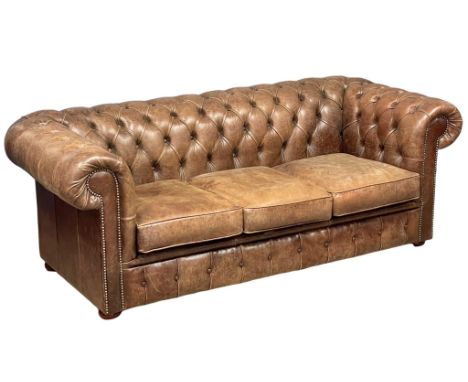 A deep button leather chesterfield 3 seater sofa. 